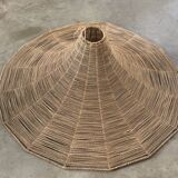 Large lampshade made of woven ropes.