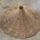 Large lampshade made of woven ropes.
