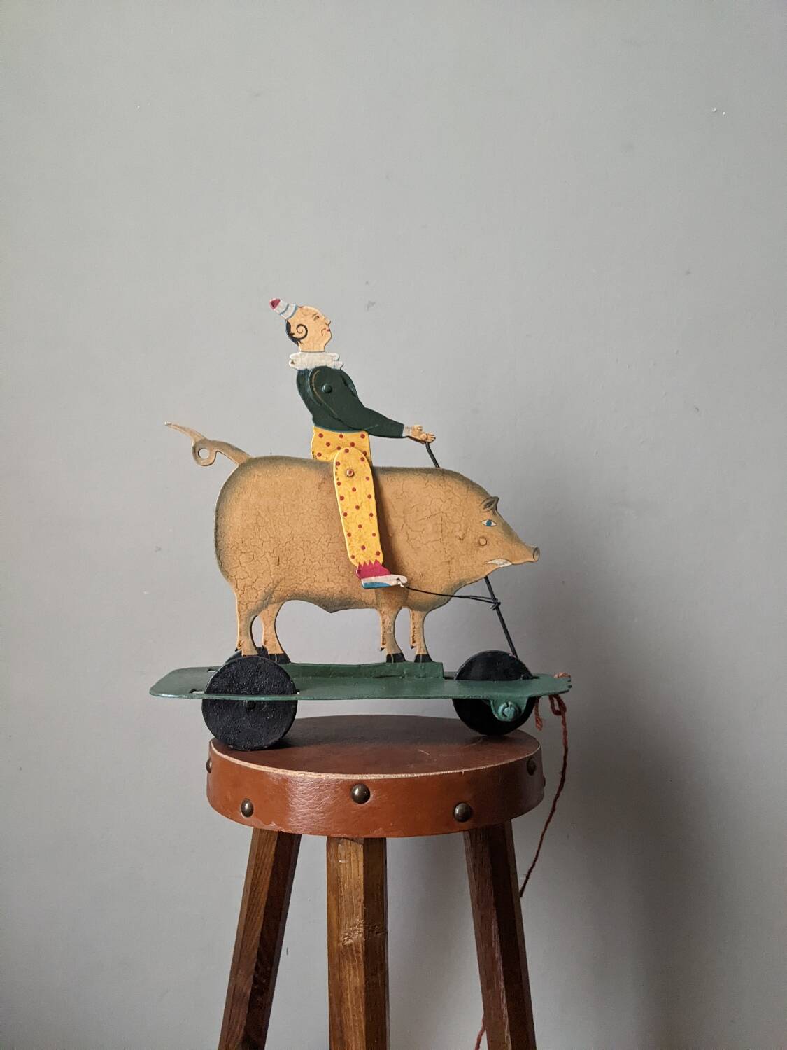 Antique pull toy, metal, hand-painted decoration, clown circus