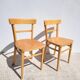 Pair of bistro chairs in light beech.