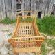 Former cradle bed baby rotin curved on vintage 60s roulettes