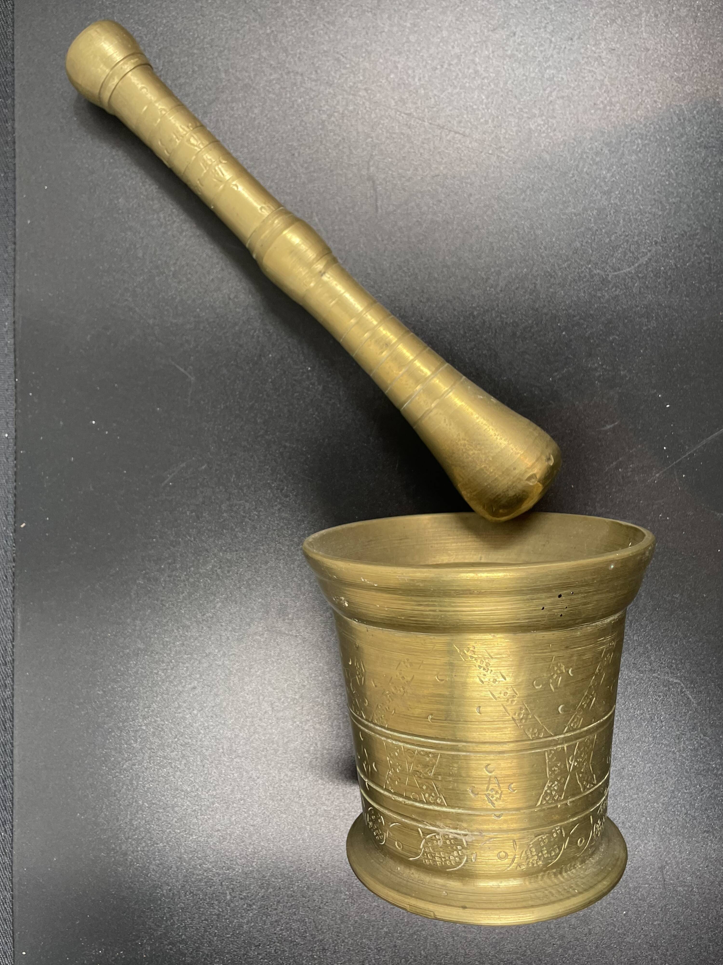 Large mortar & pestle. Chiseled bronze or brass metal, scarified decoration