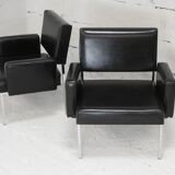 Pair of stainless steel, black leather-like armchairs, France, circa 1970