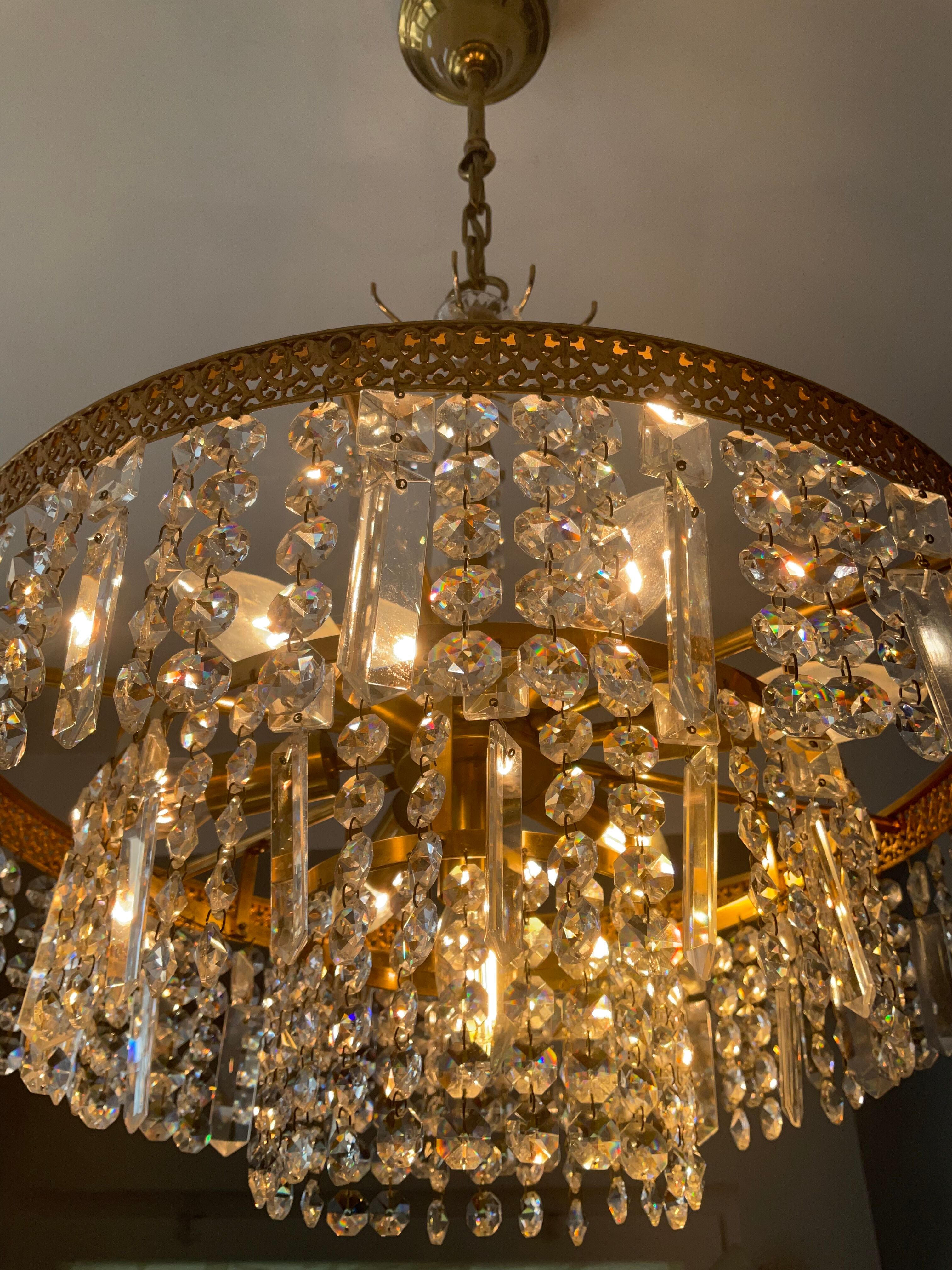 Old brass chandelier and crystal grapevines