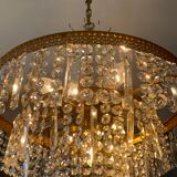 Old brass chandelier and crystal grapevines