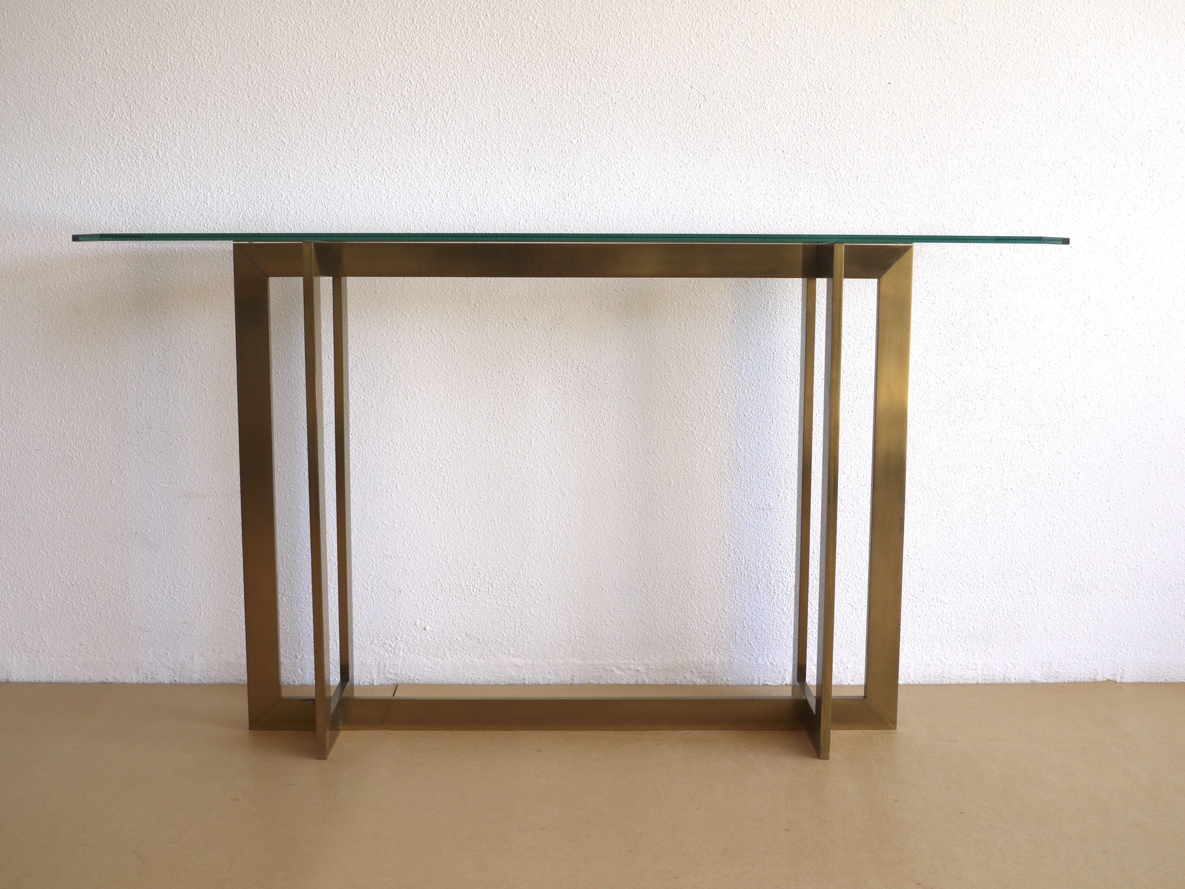 Modernist brass and glass console table & mirror. 1970s
