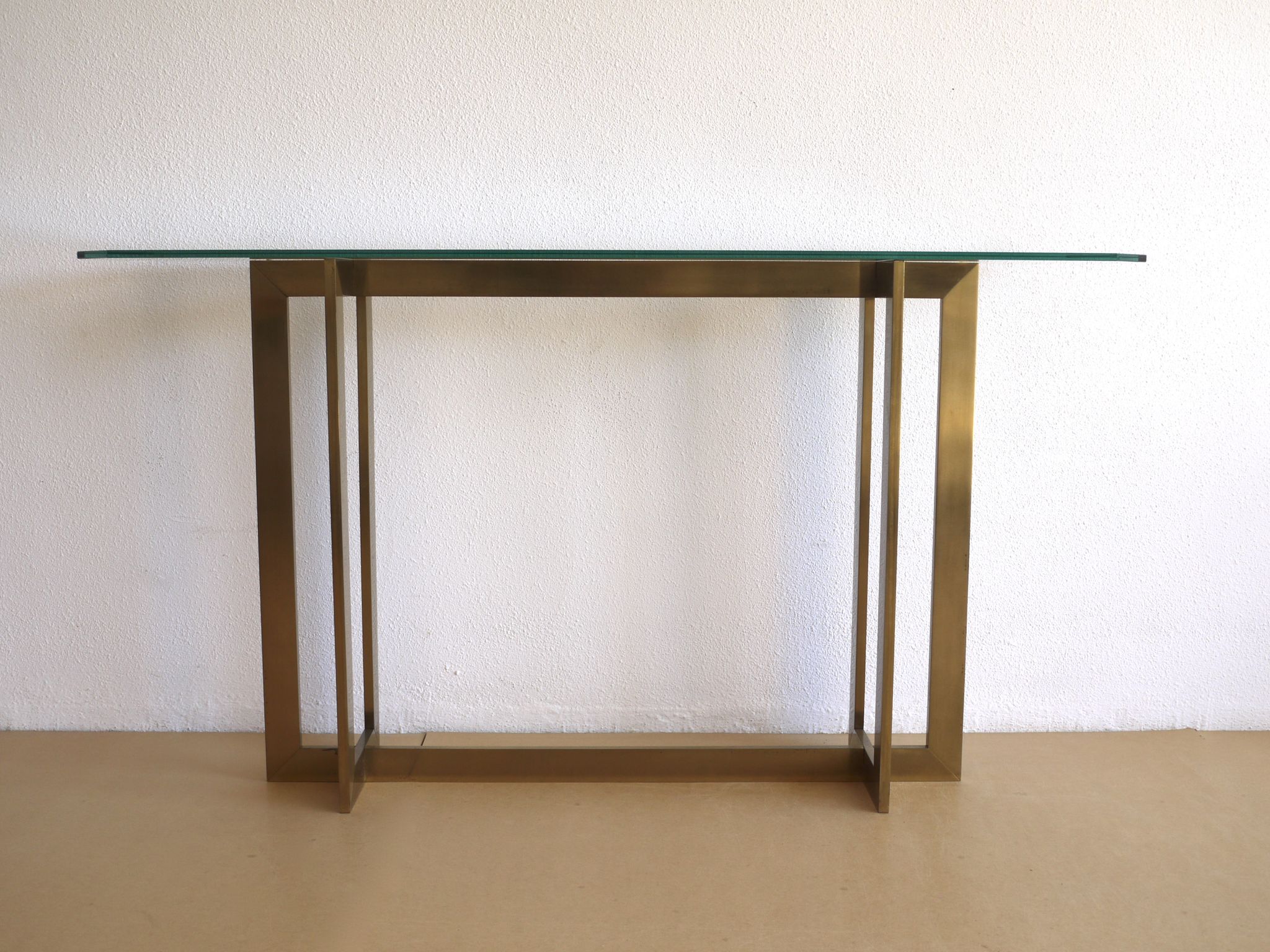 Modernist brass and glass console table & mirror. 1970s