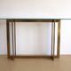 Modernist brass and glass console table & mirror. 1970s