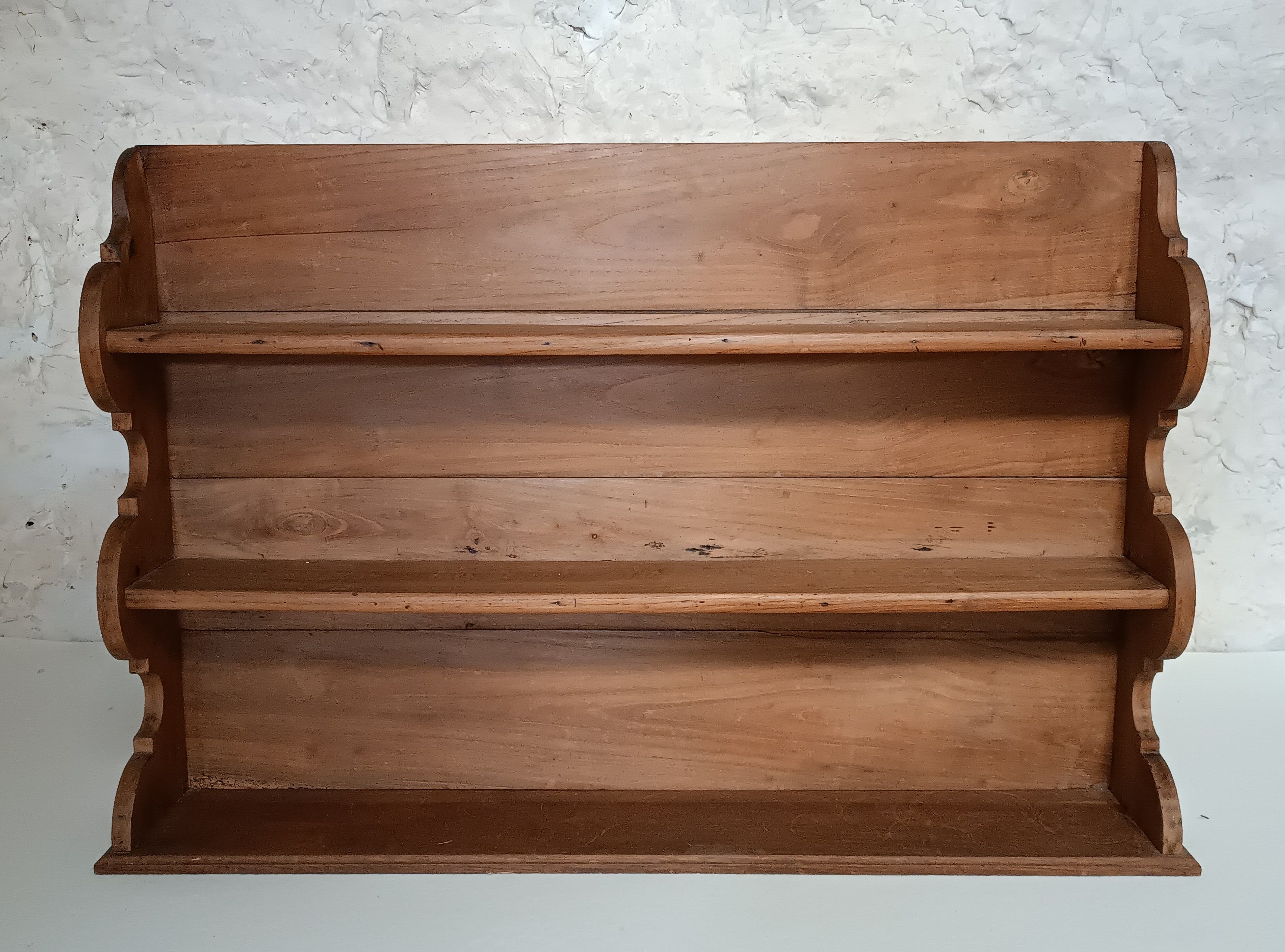 Old wall shelf in raw wood