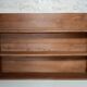Old wall shelf in raw wood