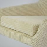 Cream corduroy swivel shell armchairs