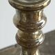 Antique mercury glass candlestick with a patina and silver finish.