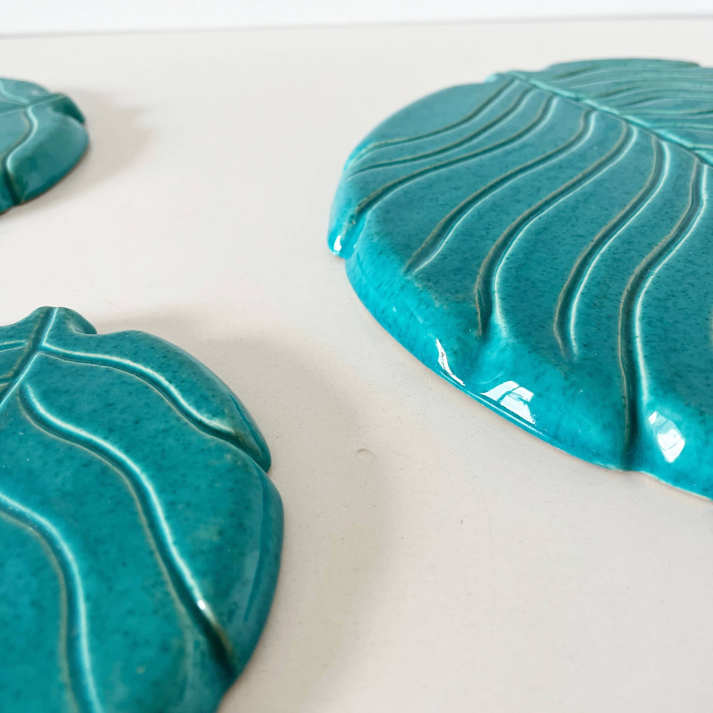 Ceramic trivet and bottle coaster from the 1950s.