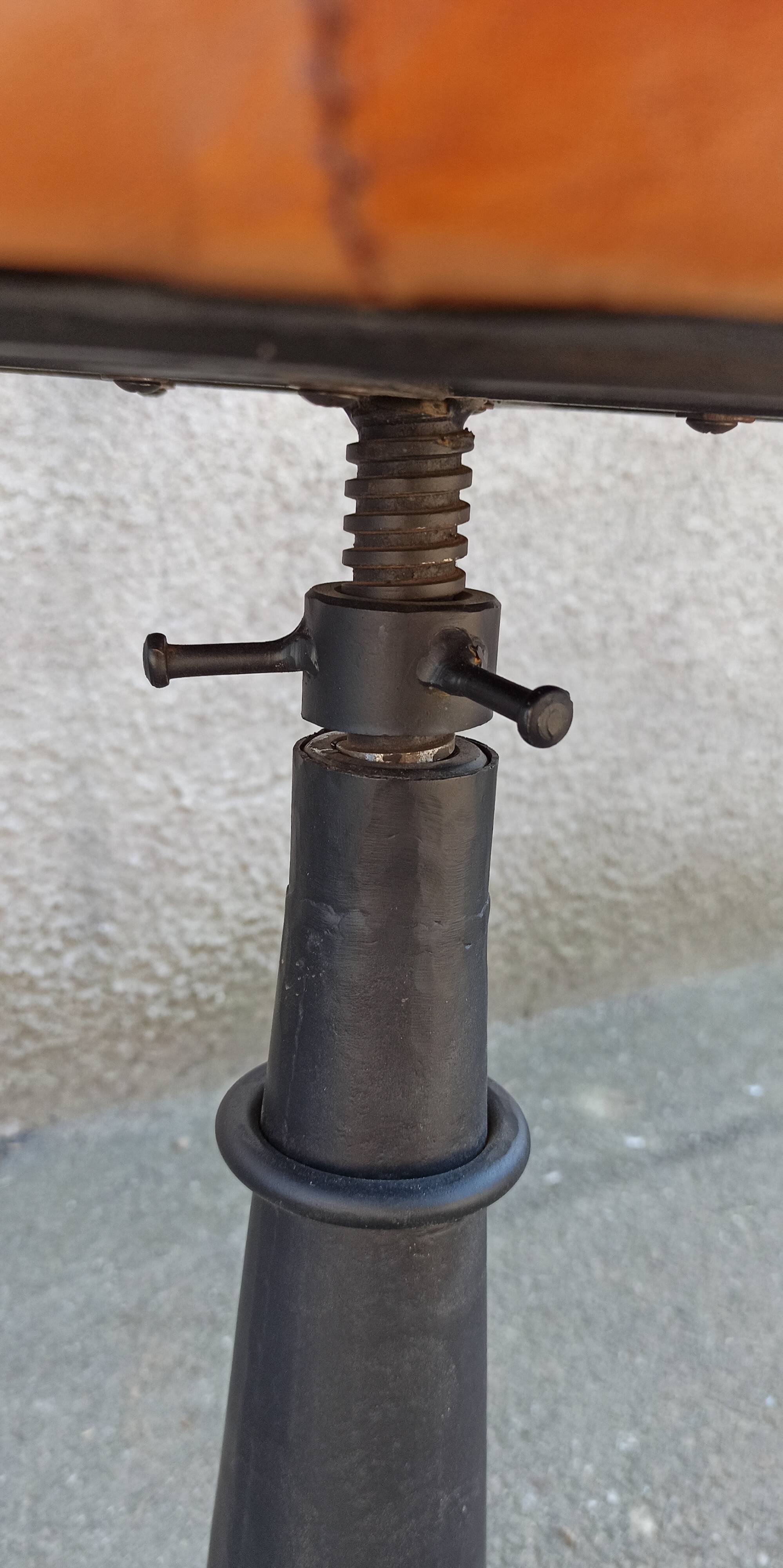 Height-adjustable leather stool with cast iron base