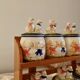 Vintage wooden wall condiment shelf and porcelain pots with geese slip pattern