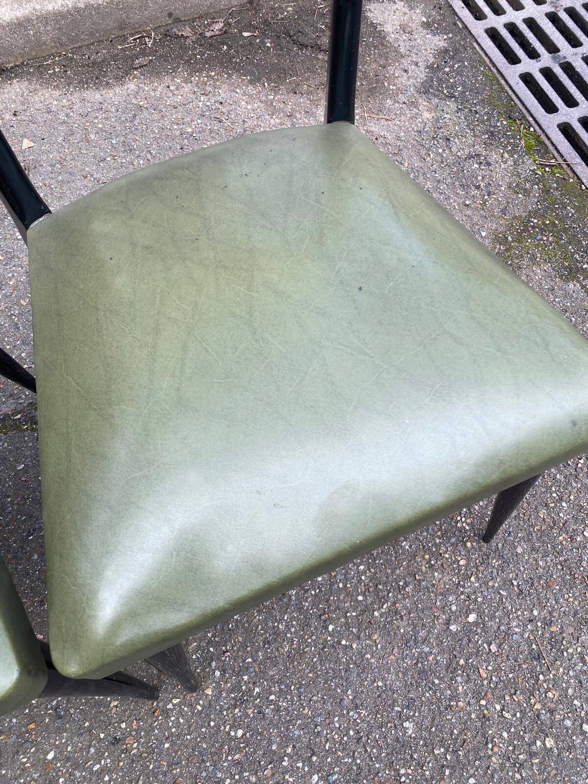 6 Italian design dining chairs in Scandinavian style with wood and olive green leather.