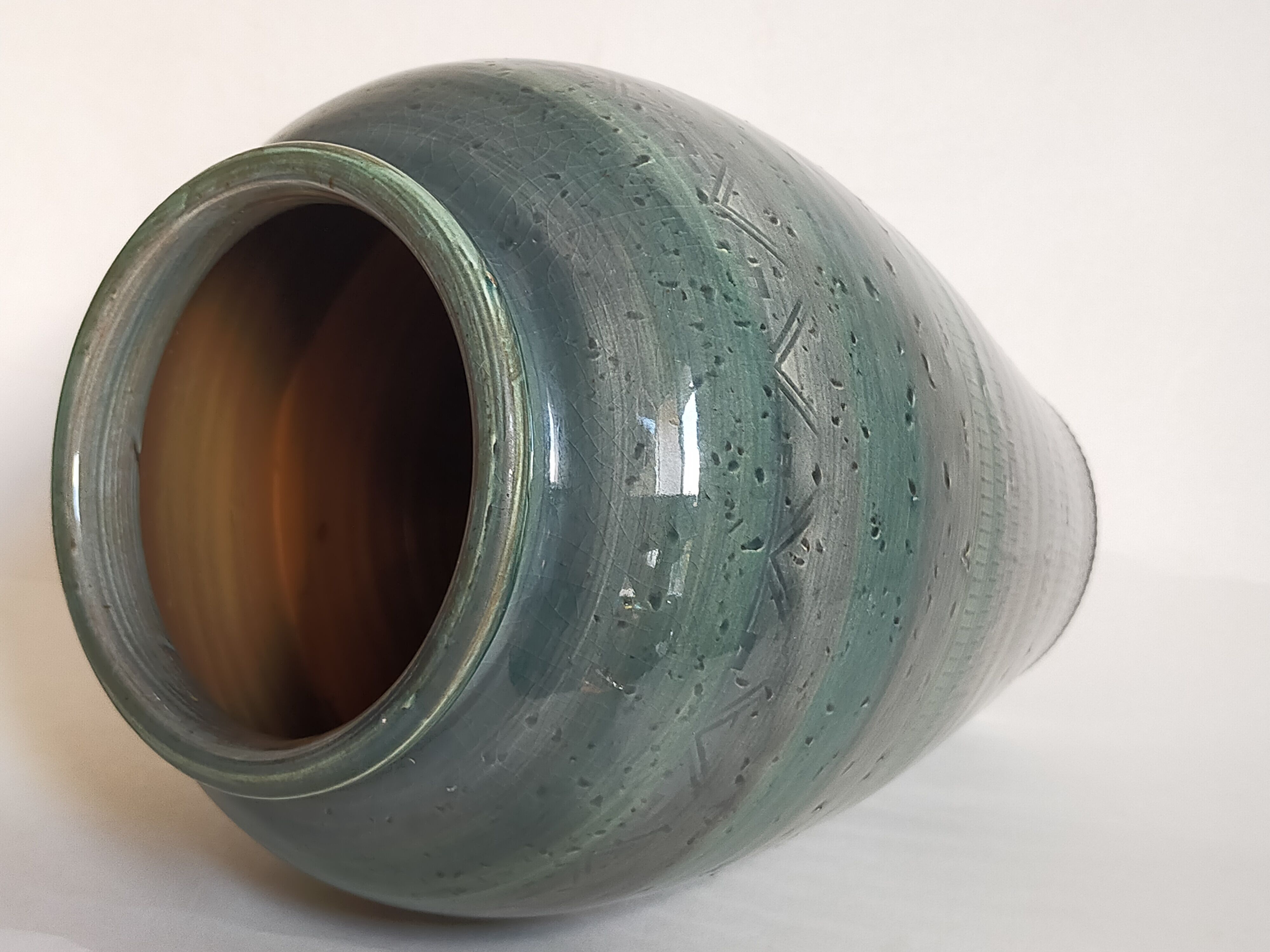 Oblong ceramic vase sacrificed with blue enamel