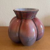 Blown glass vase with metal cage