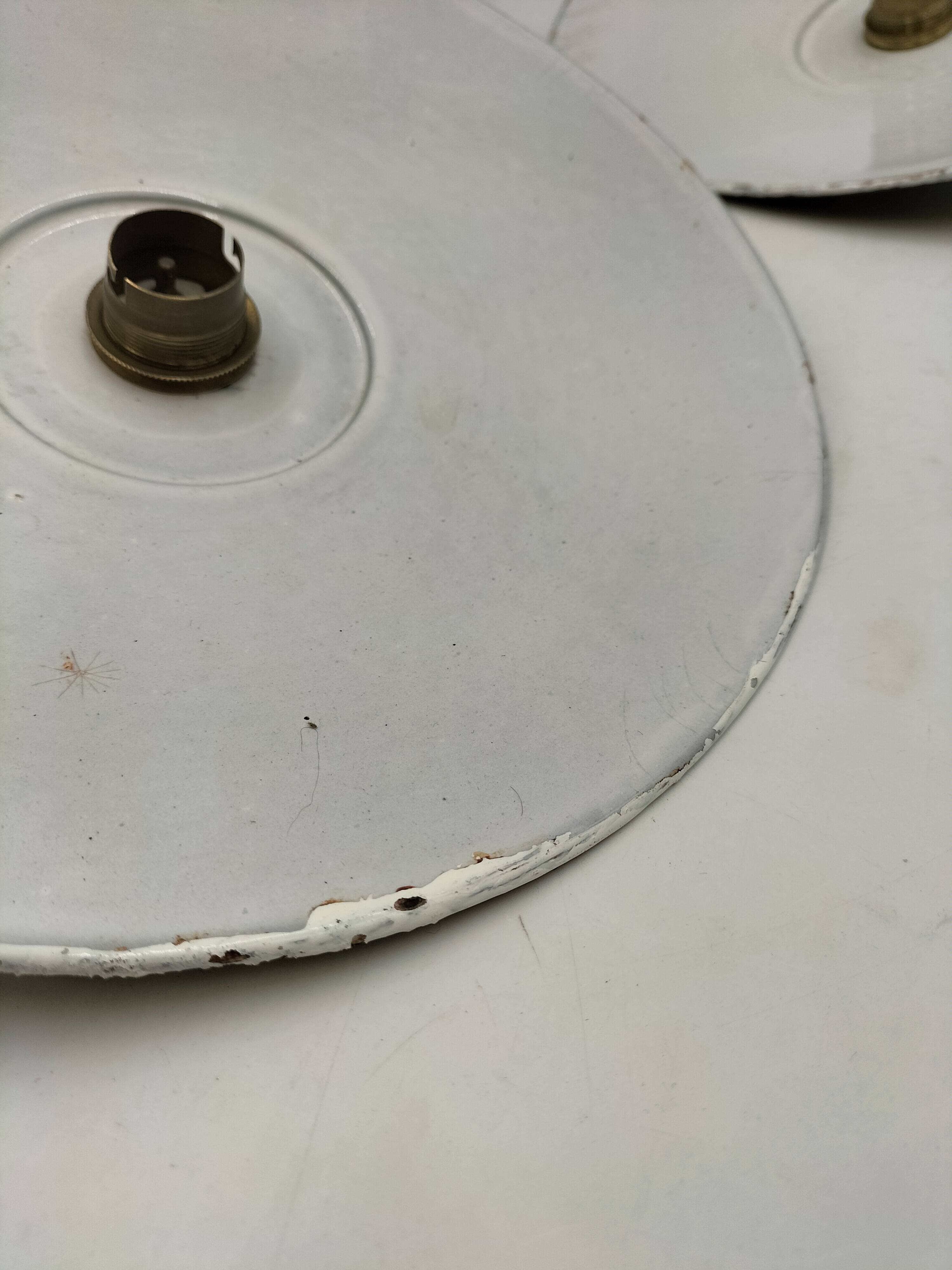 Three enamelled sheet metal suspensions