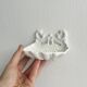 Bathroom décor, hooks, soap dish, white metal hangers.