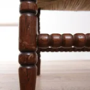 Antique Dutch oak corner chair with turned spindles and new rush seat