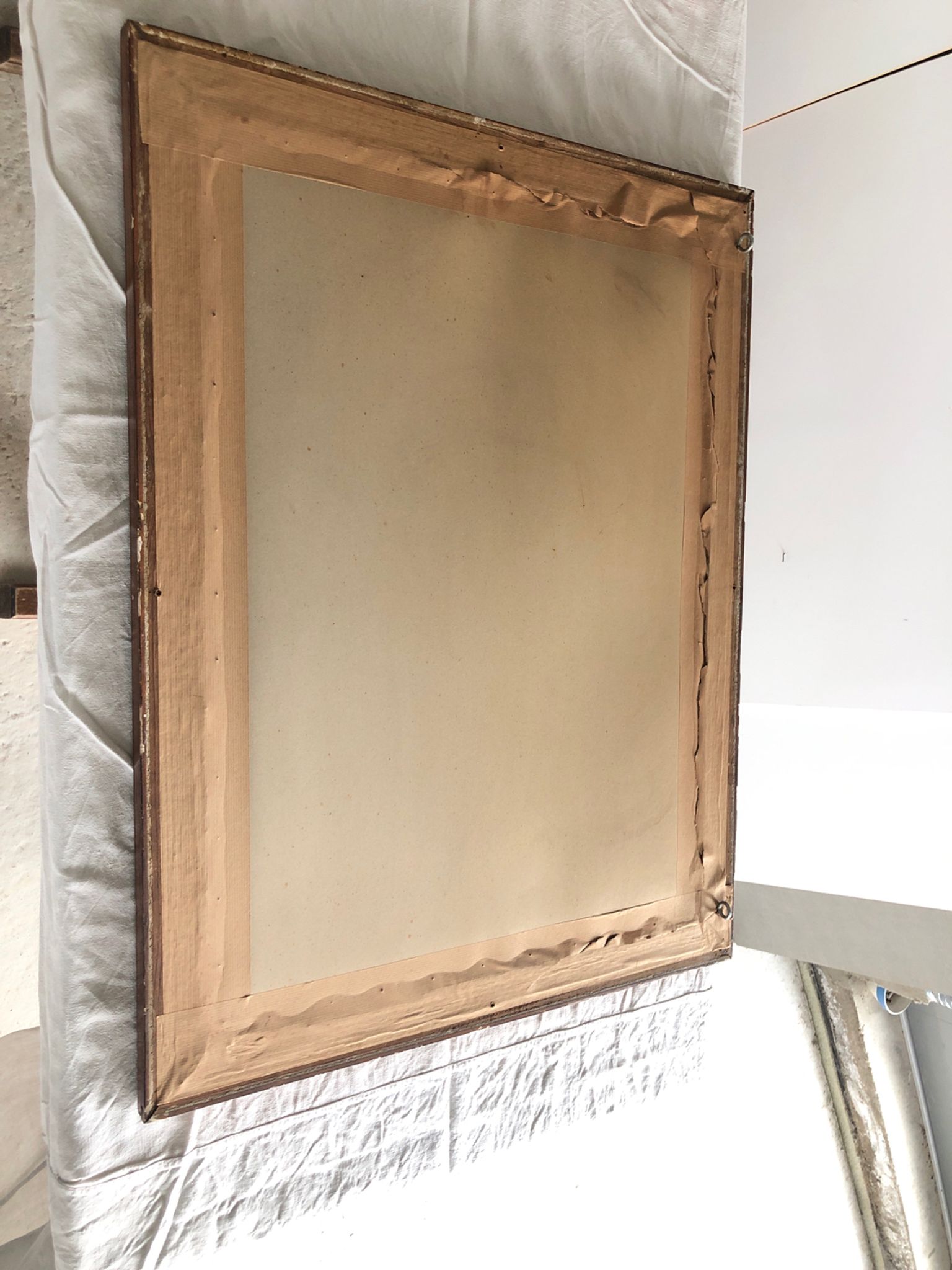 Old mirror with wooden frame and plaster moldings