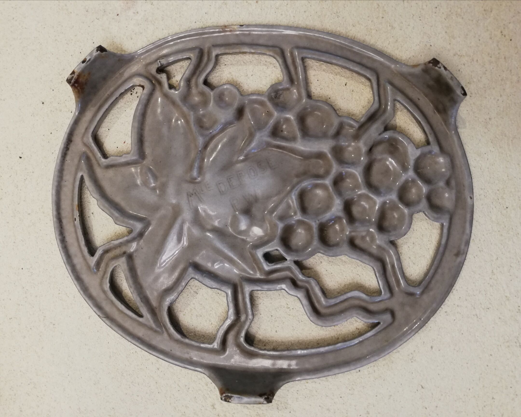 Cast iron underside bunch of grapes