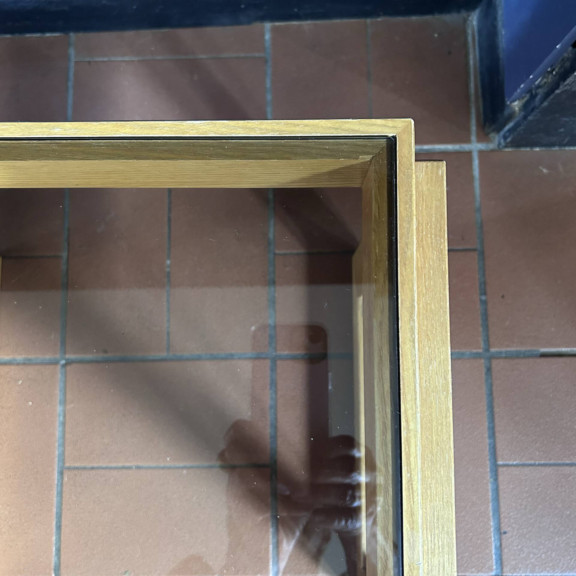 Modernist side table in wood and smoked glass