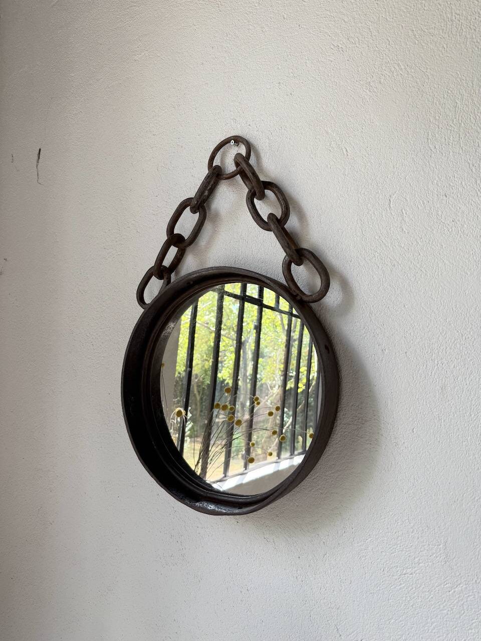 Brutalist mirror with metal chain from the 50s