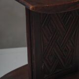 Sculptural African stool in hardwood, curved seat and architectural base, 1970s.