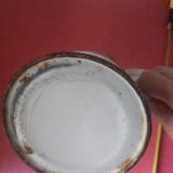 Enamelled sheet metal pitcher Lustucru décor