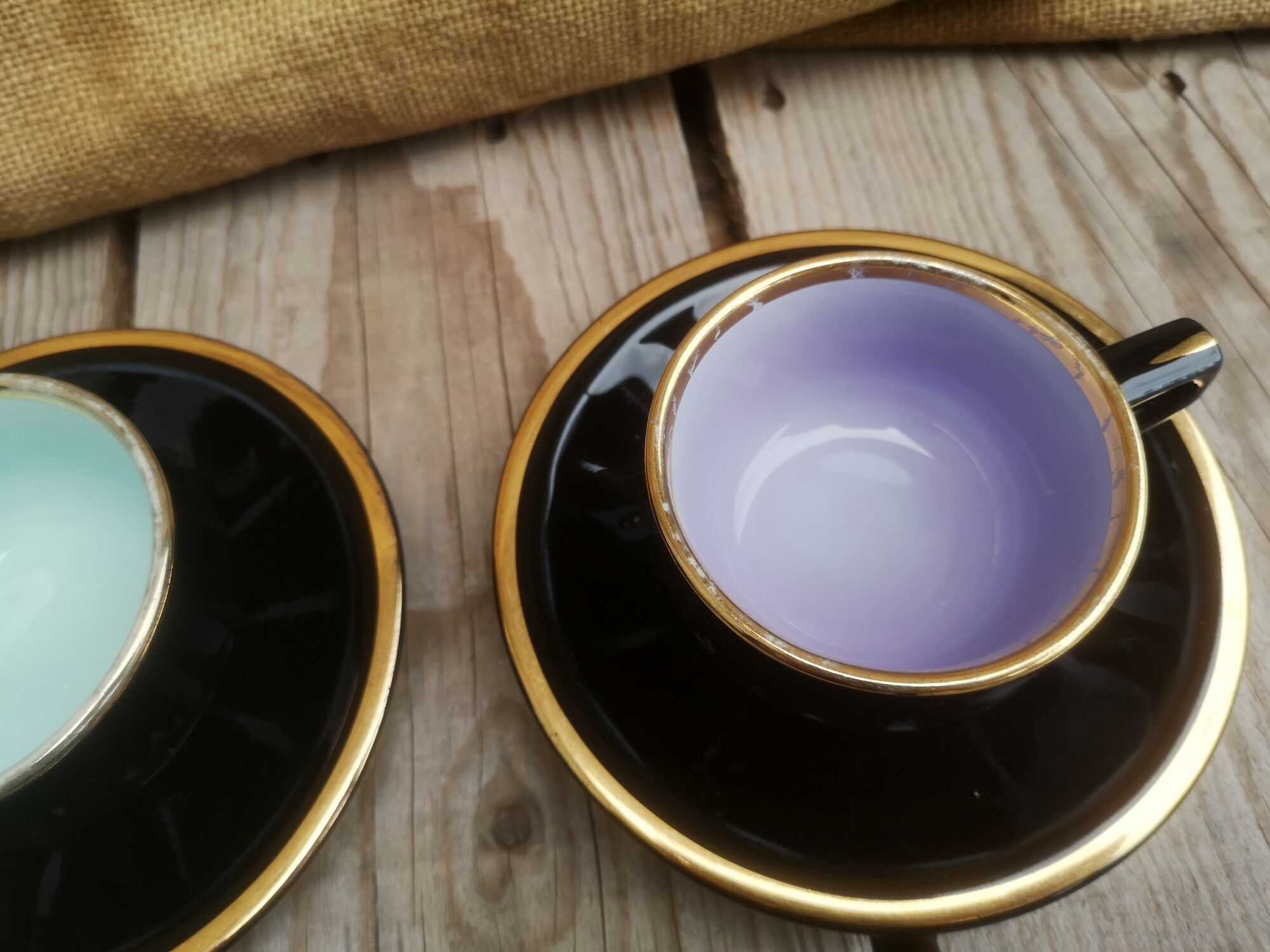 Set of 9 cups and sub-cups in black ceramic and colored gold border