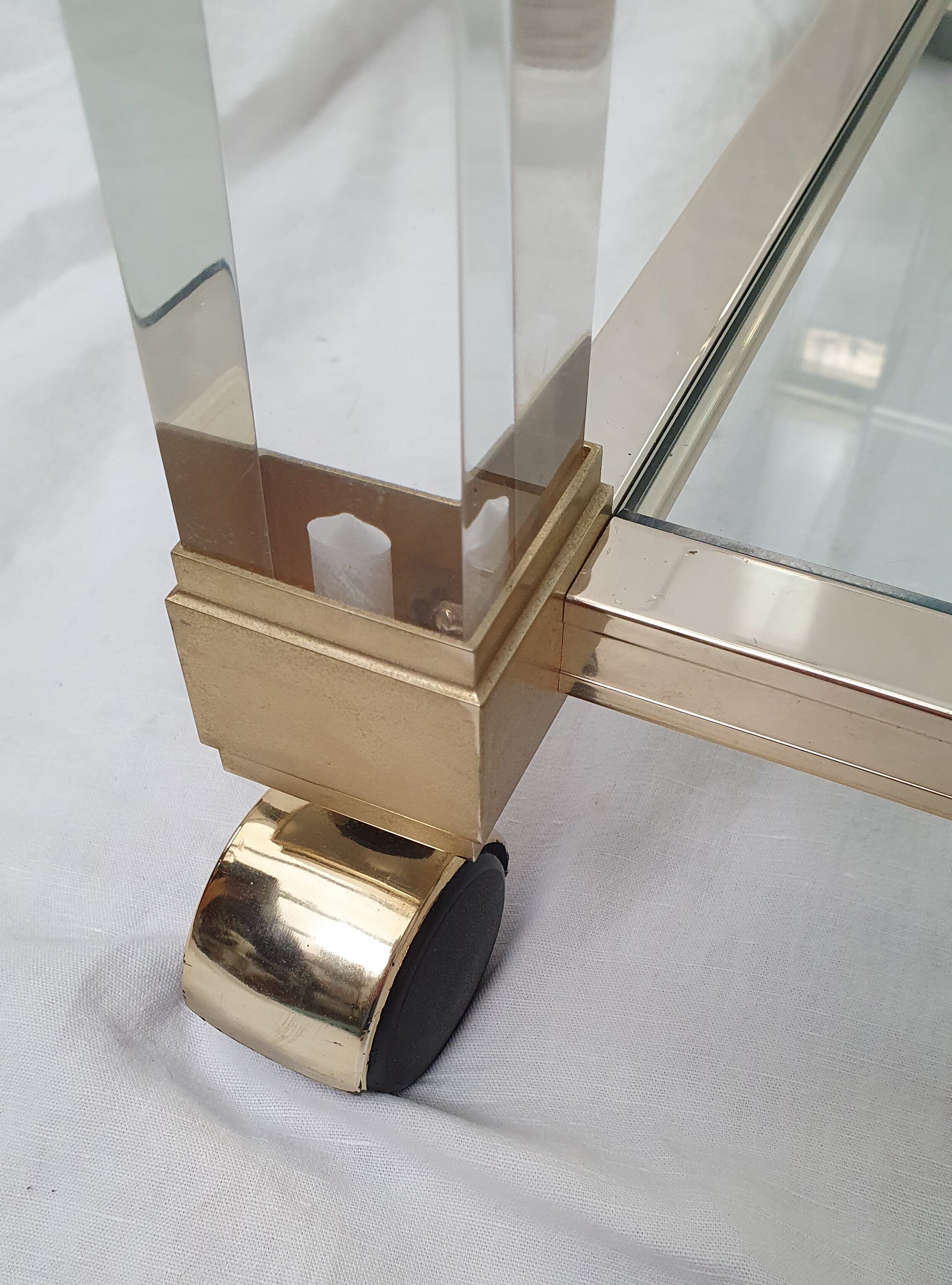 Rolling glass and plexiglass shelf by Pierre Vandel