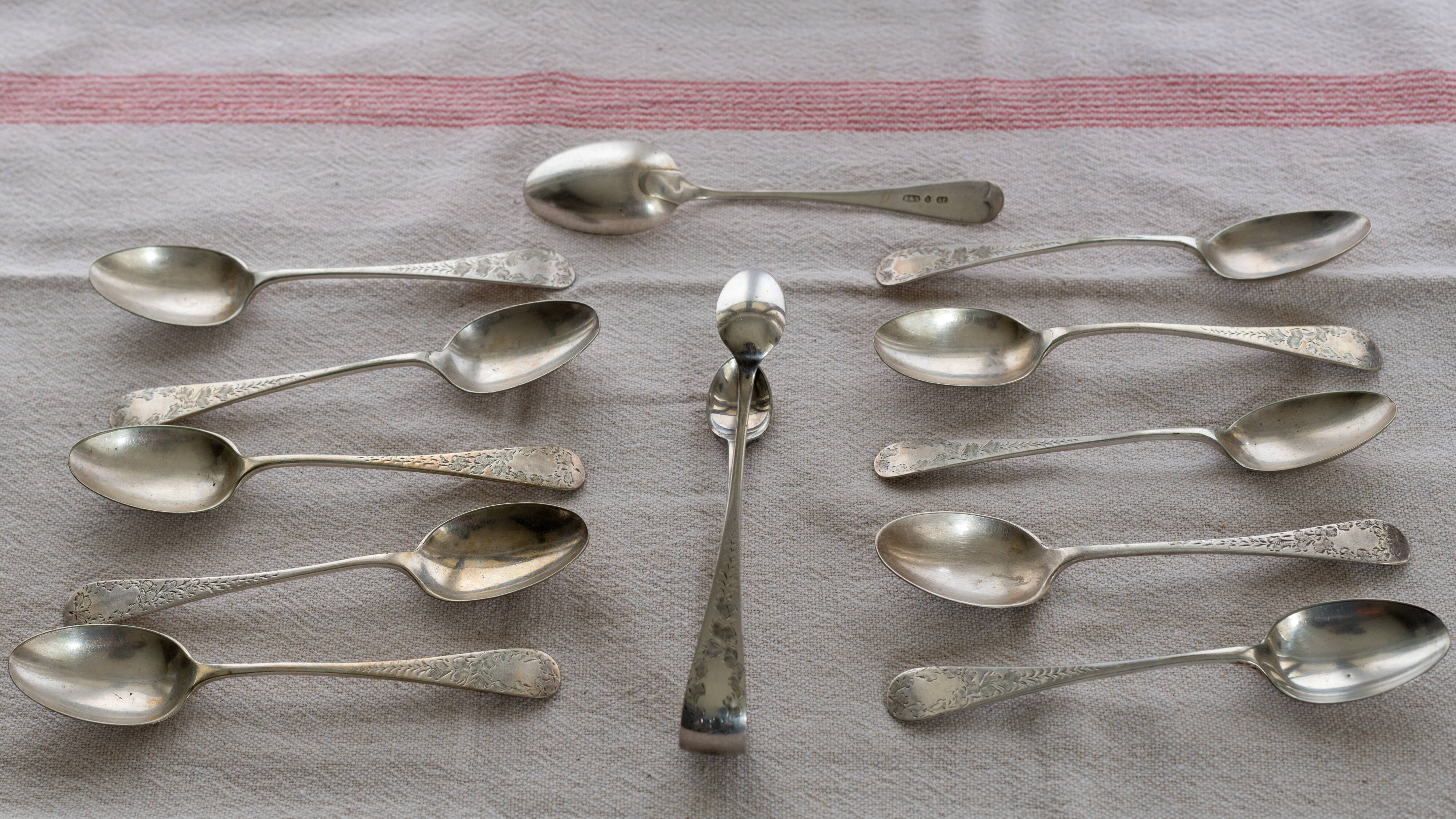 Box of old English coffee or tea spoons and their sugar tongs, silver plated