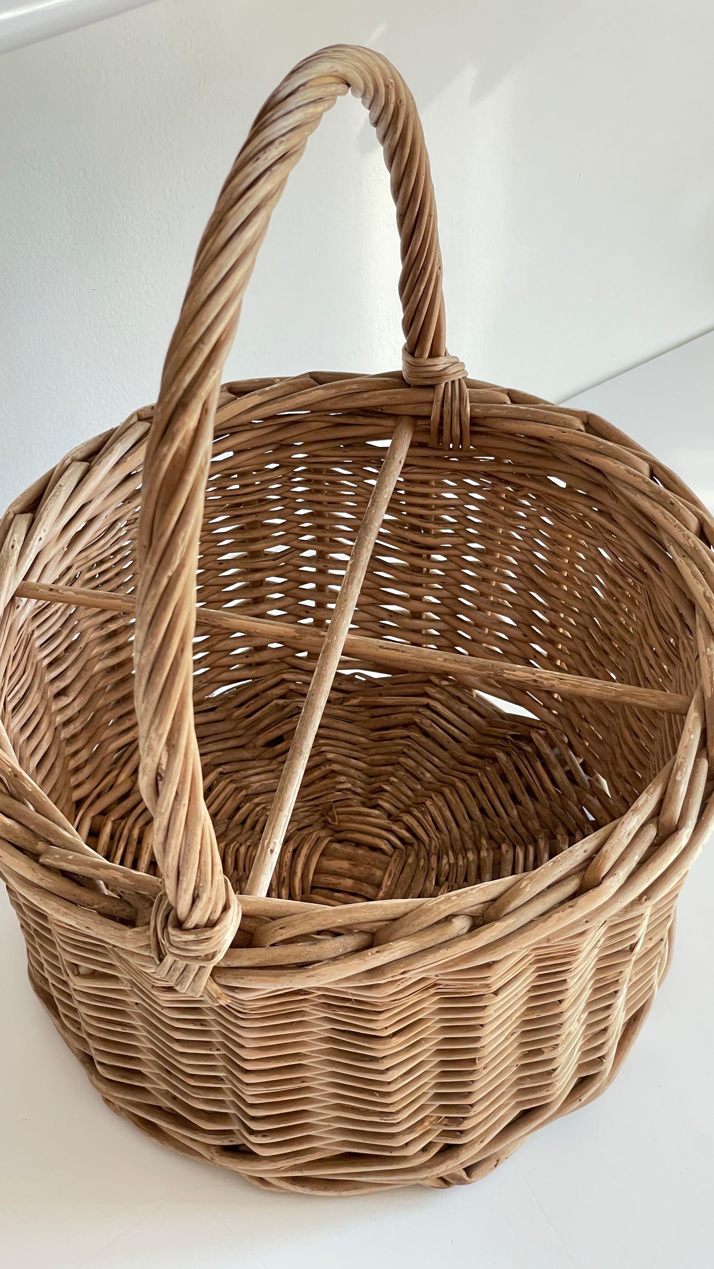 Basket with vintage rattan bottles