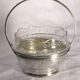 Small cut glass bowl with a handle in silver-plated metal, 13x14cm, early 20th century.