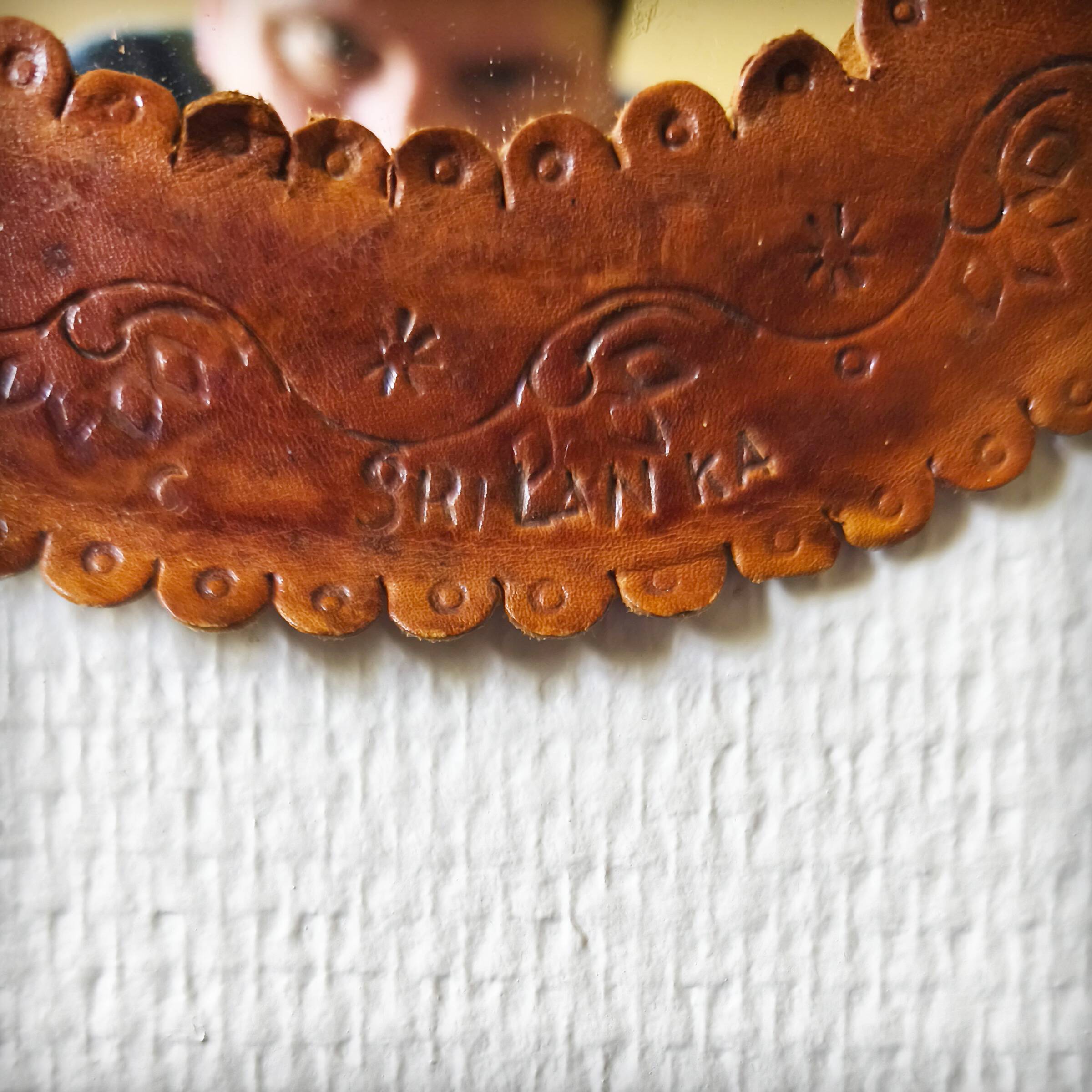 Leather repoussé mirror, Sri Lanka, 1960s