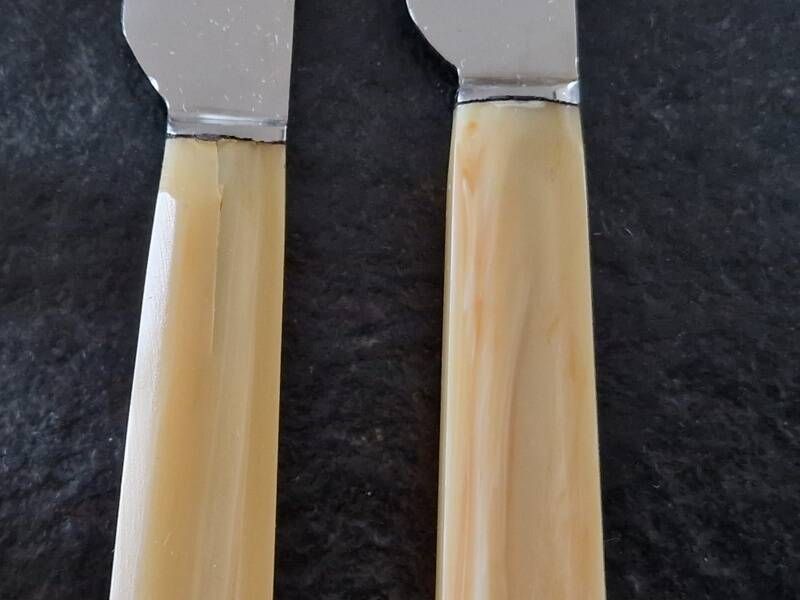 Philos - Set of 12 stainless steel dessert knives with bakelite handles.