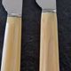 Philos - Set of 12 stainless steel dessert knives with bakelite handles.
