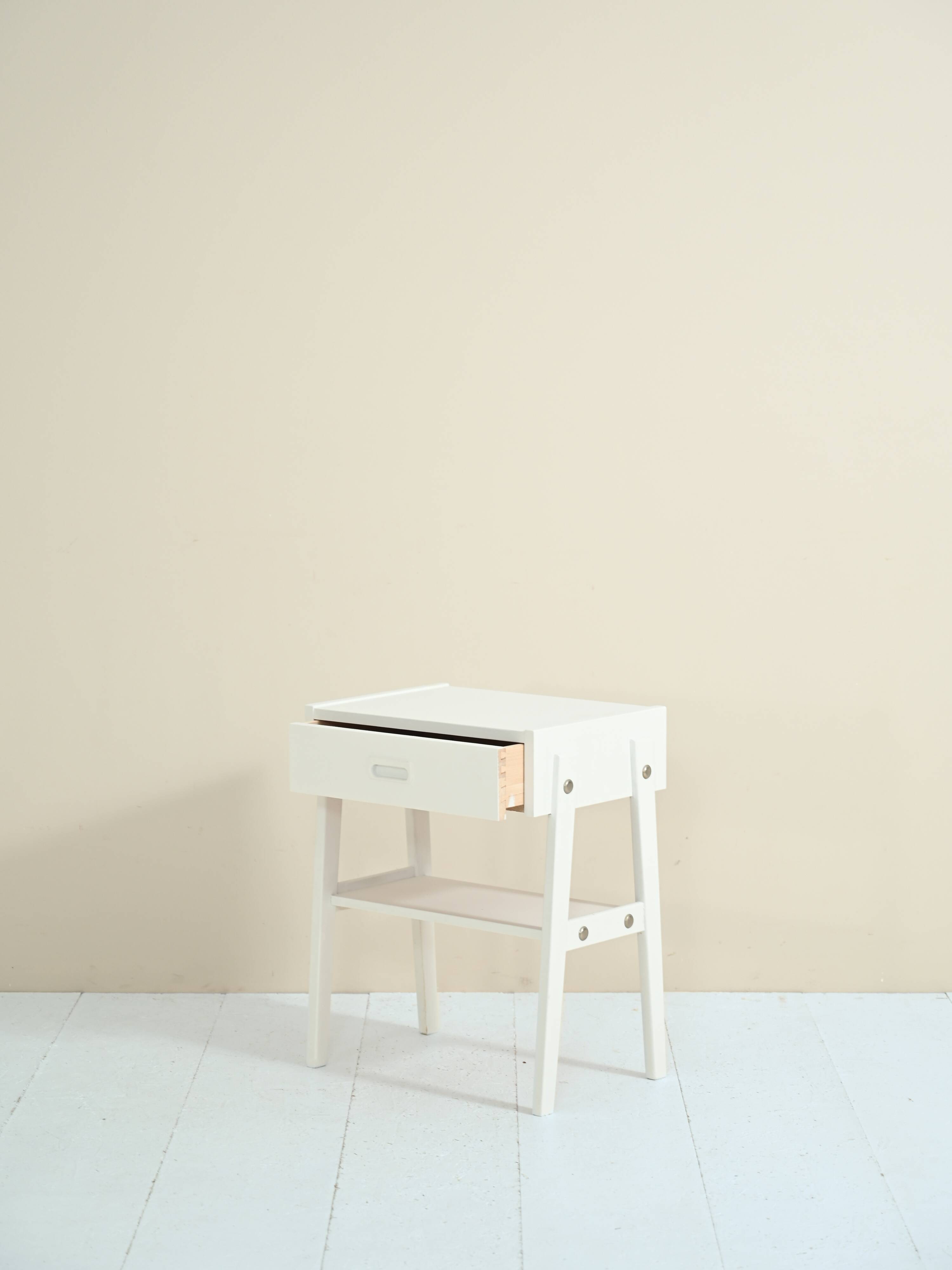 Scandinavian bedside table painted in white