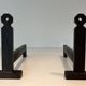 Pair of Minimalist Modernist Wrought Iron Chenets with Torch Holders in Nut Design