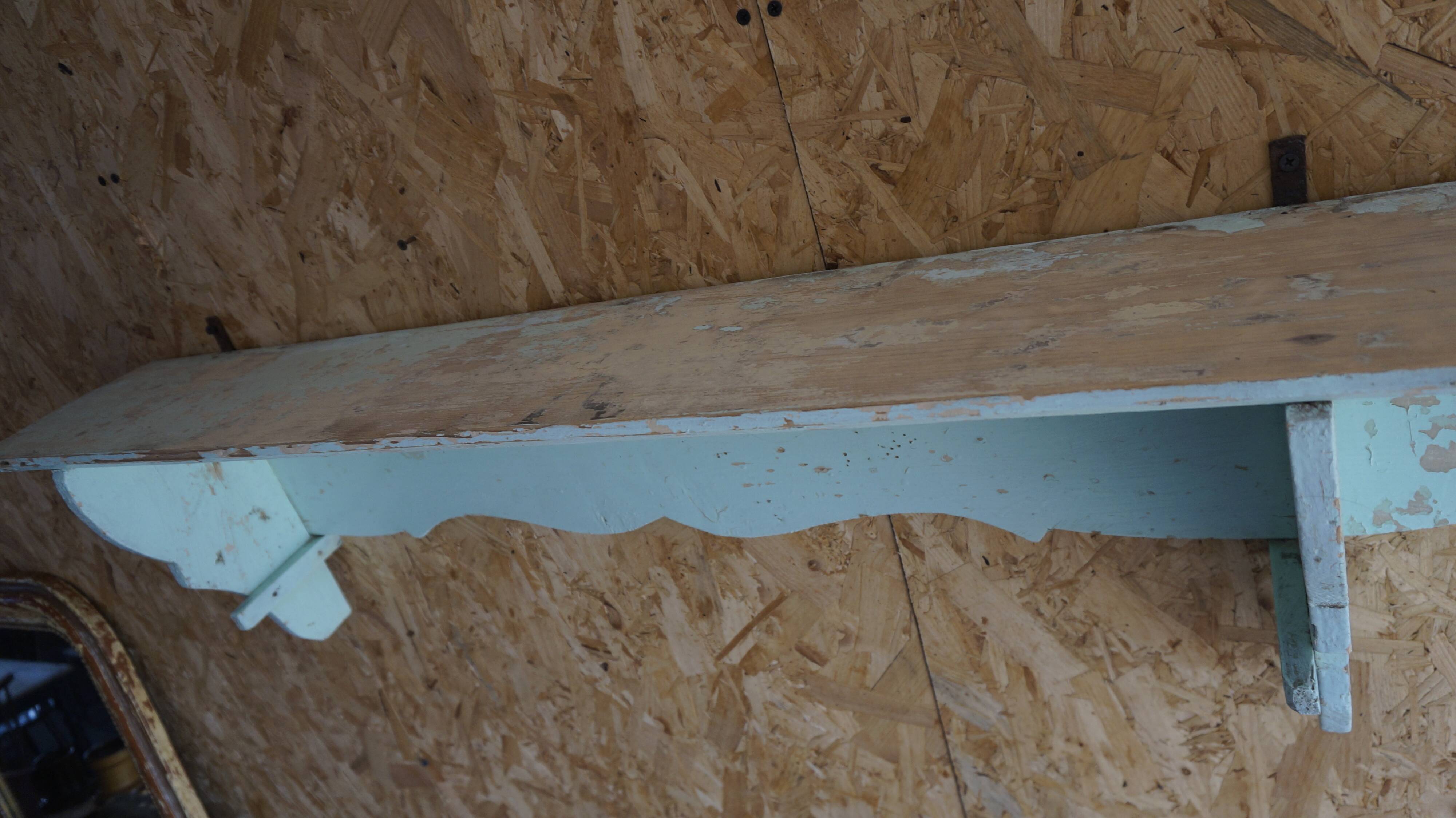 Patinated wooden wall shelf