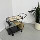 Perforated metal serving trolley in the Mathieu Matégot style