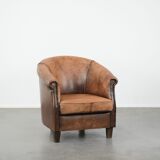 Vintage sheepskin club armchair with character and a beautiful patina