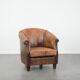 Vintage sheepskin club armchair with character and a beautiful patina
