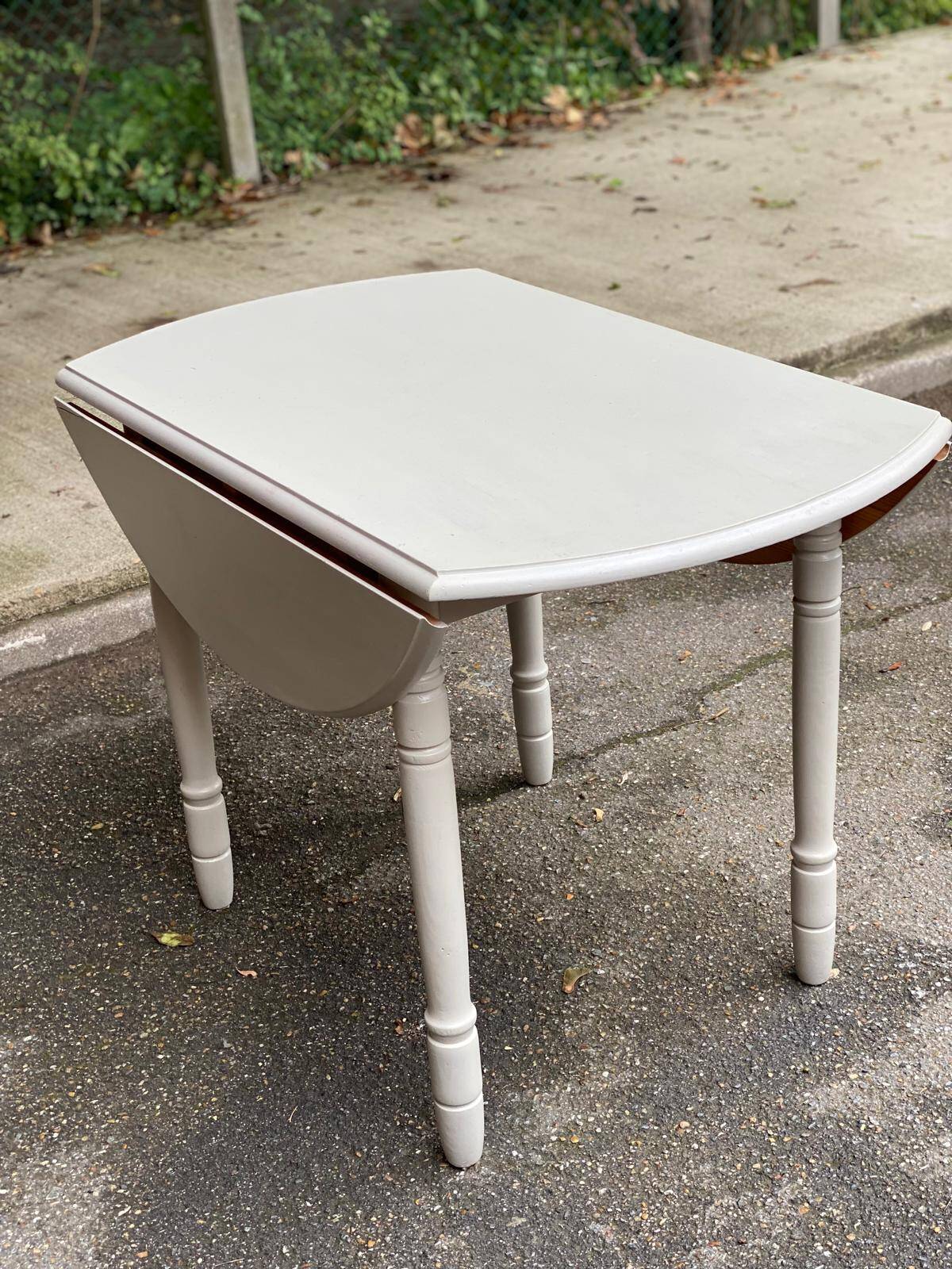 Louis Philippe round dining table with folding shutters repainted in beige grey