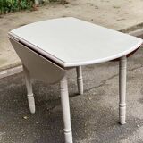 Louis Philippe round dining table with folding shutters repainted in beige grey