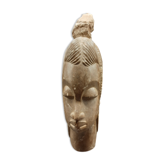 Bust of an African woman in mbigou stone