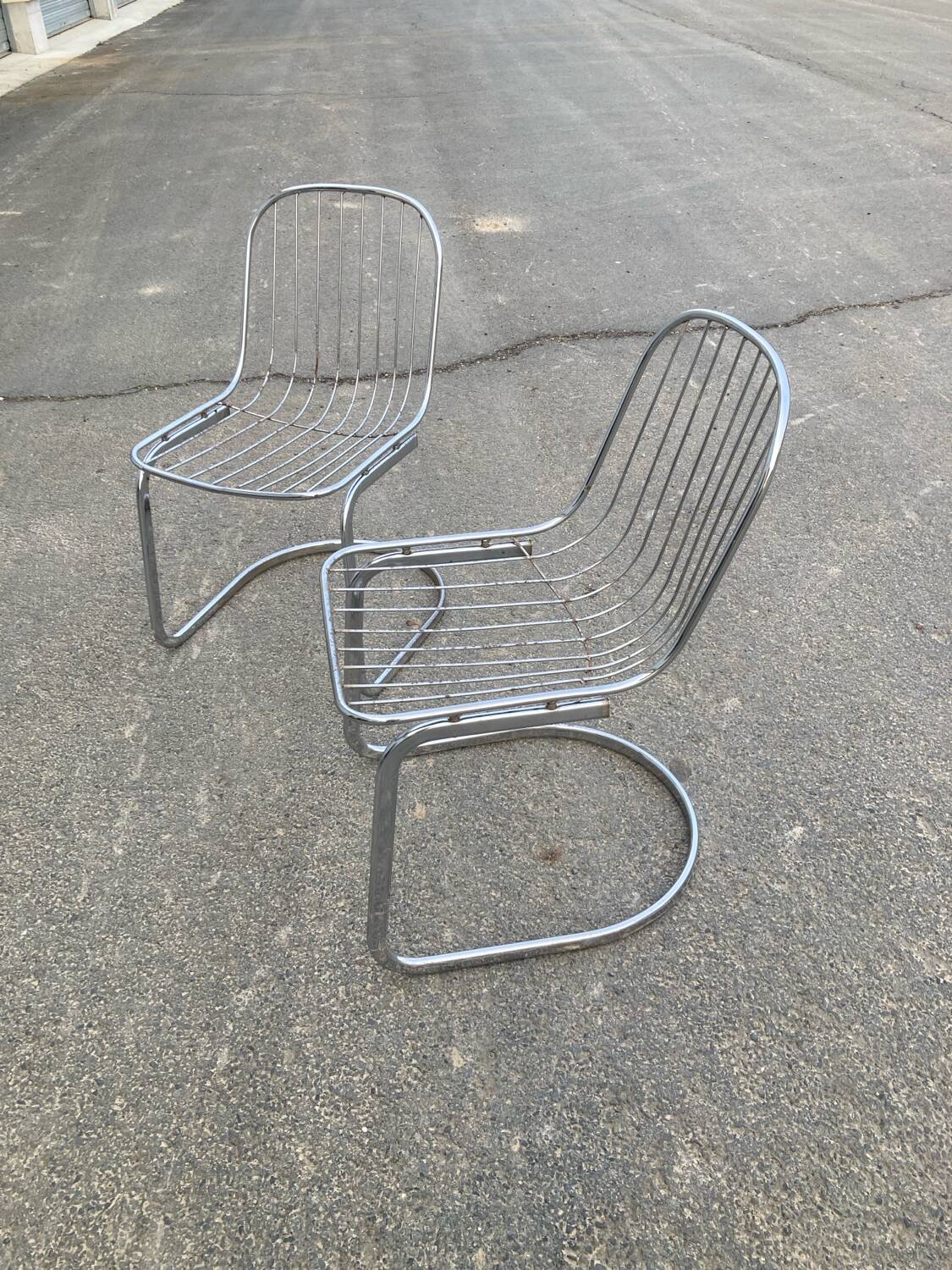 Two Gastone Rinaldi style chrome metal chairs.