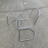 Two Gastone Rinaldi style chrome metal chairs.